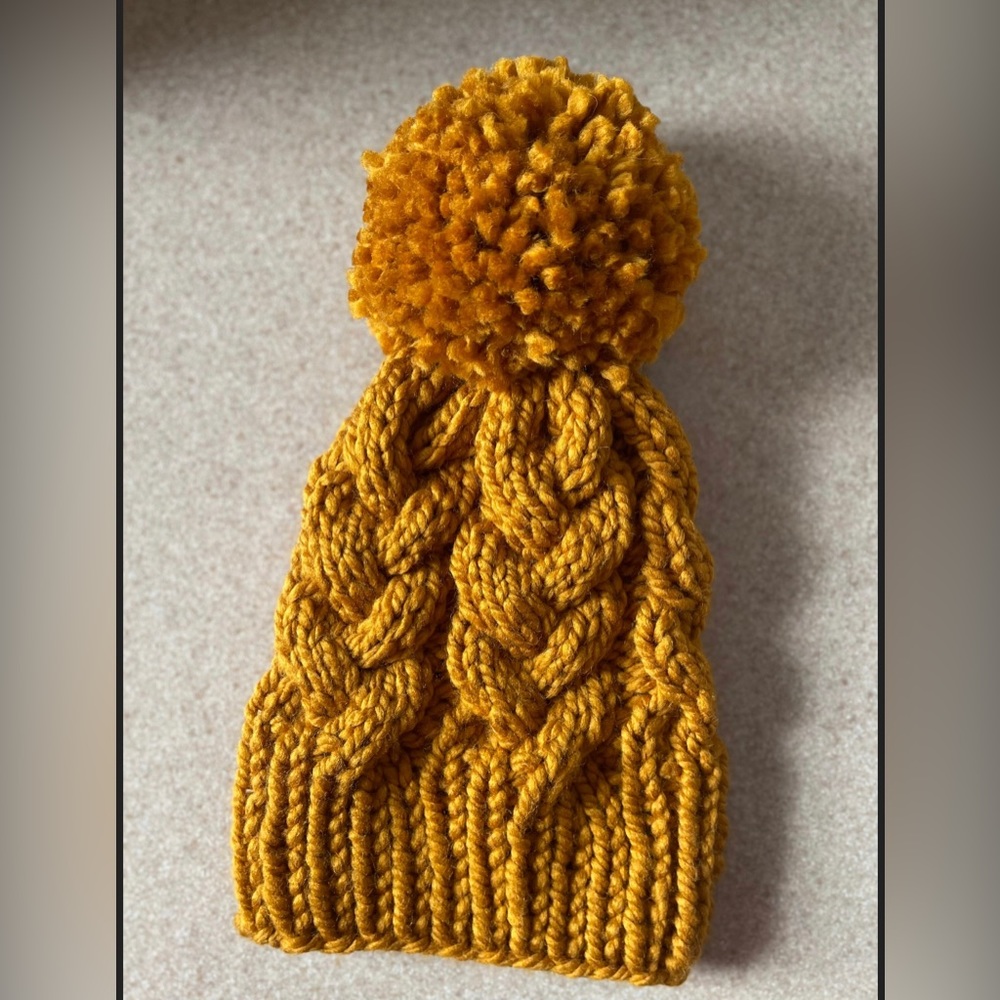 Hand knit cable beanie with giant pompon-butterscotch.